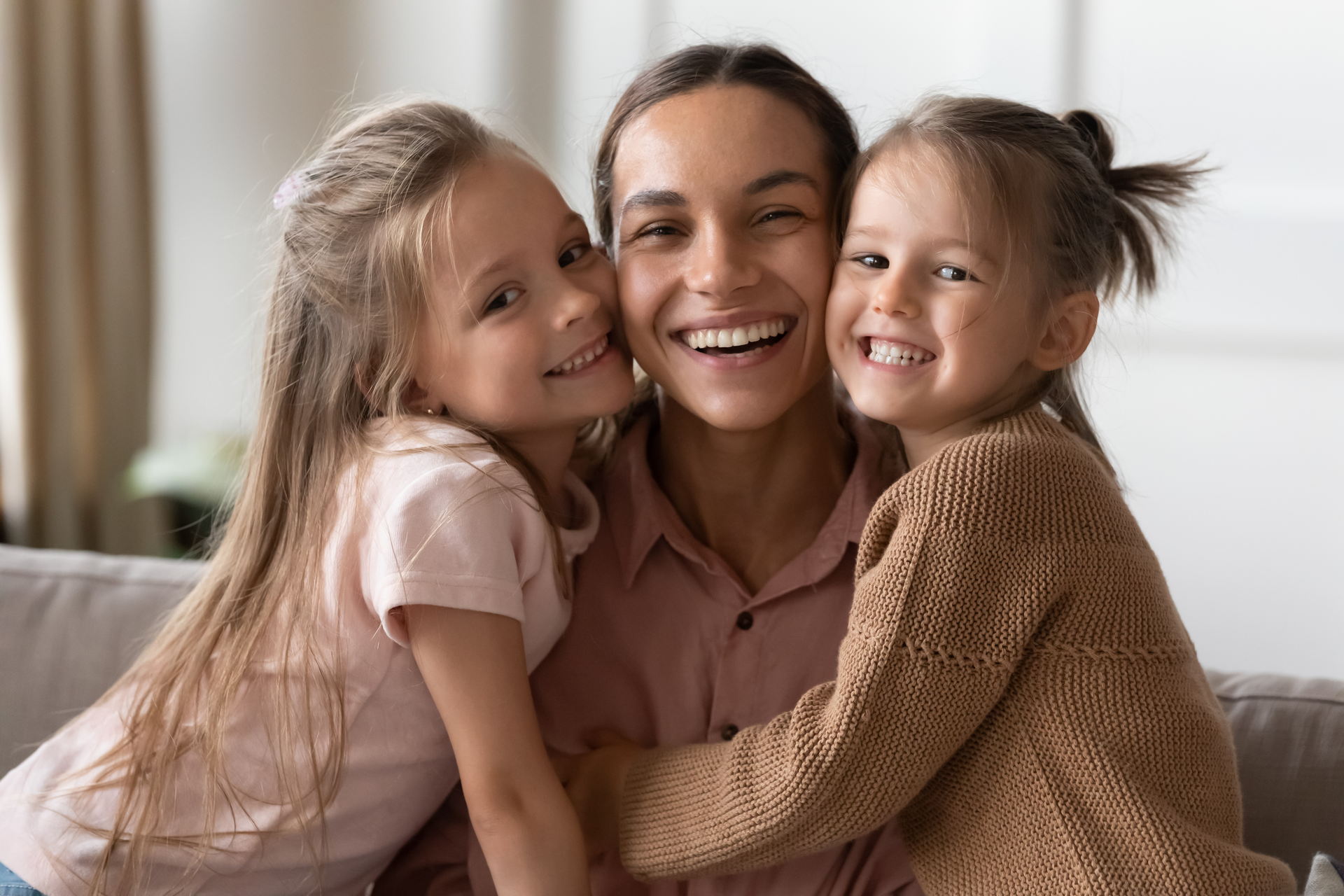 a woman and two girls posing for a picture